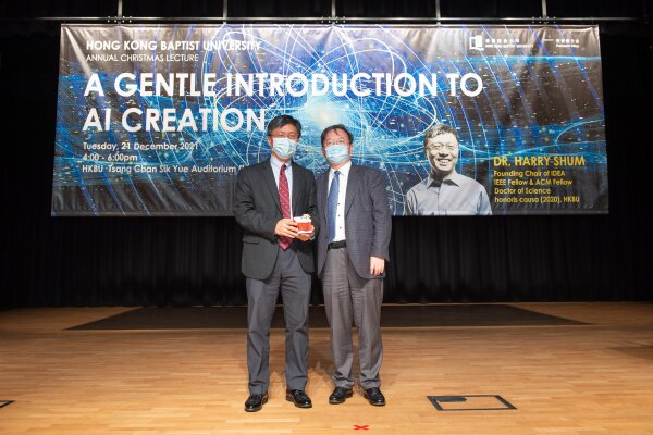 Prof Yike Guo (right), Vice President (Research and Development), presented a souvenir to Dr Harry Shum (left).