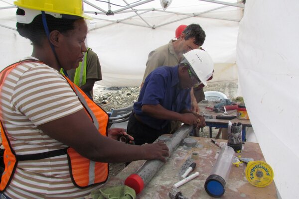 Dr Veronica Muiruri, one of the study’s co-authors (left), labels a freshly sealed sediment core sample from Lake Magadi in Kenya. Credit: Anne Billingsley