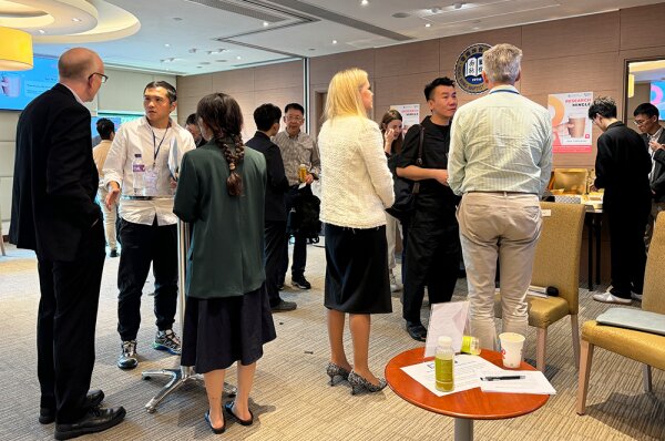 The participating researchers enjoy the refreshments and relish mingling with one another.