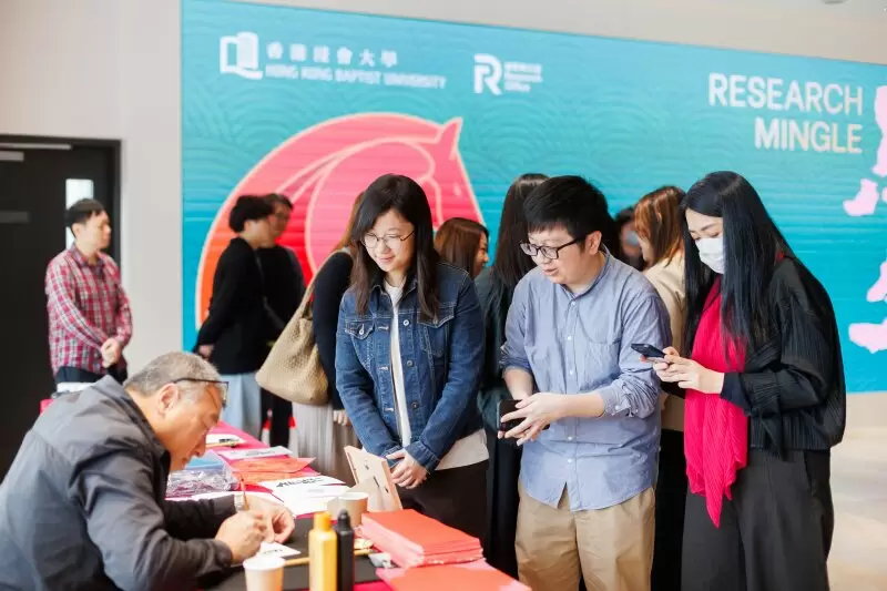 Attendees at the calligraphy booth