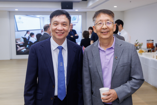 Professor Zhang Han (left), Dean and Chair Professor, School of Business, and Professor Wei Ran, Associate Dean (Research and Development) and Chair Professor, School of Communication, attend the event to celebrate the honorees and foster meaningful dialogue within fellow researchers.