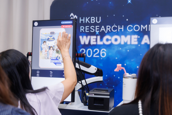 Researchers engage with interactive activities at the fun booth, designing their own tote bags and luggage tags.