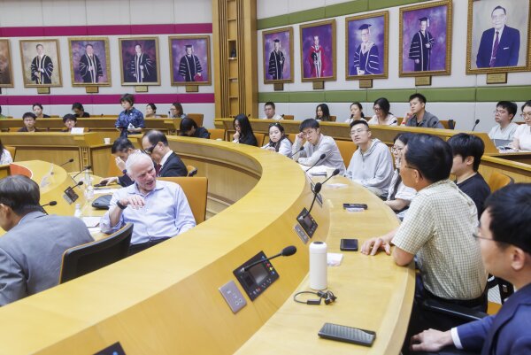 Professors and participants actively engage in the Q&A session, posing incursive questions to Professor Hood