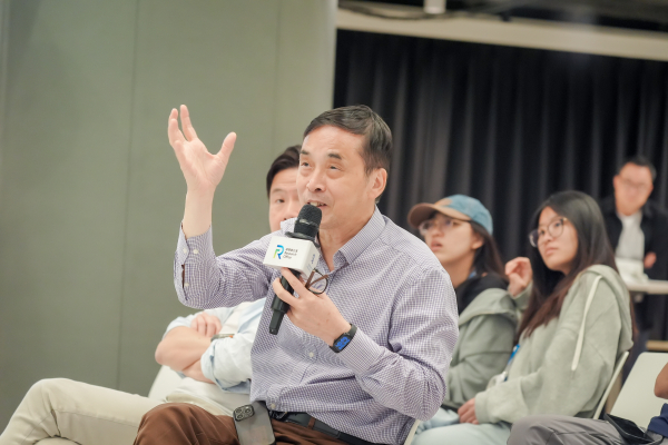 Professors and participants actively engage in the Q&A session, posing thought-provoking questions to Professor Deng