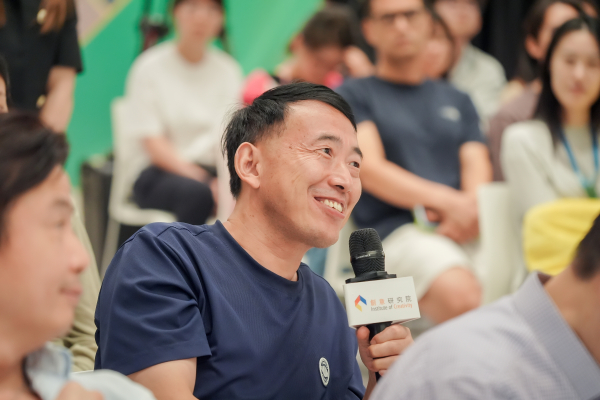 Professors and participants actively engage in the Q&A session, posing thought-provoking questions to Professor Deng