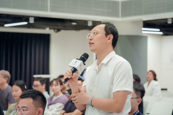 Professors and participants actively engage in the Q&A session, posing thought-provoking questions to Professor Deng