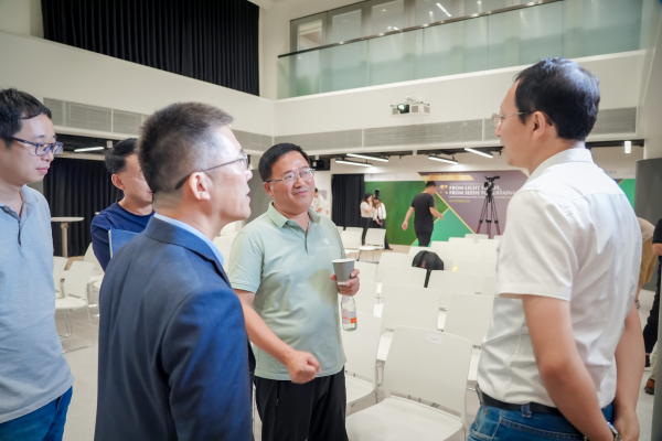 Professors and participants actively engage in the Q&A session, posing thought-provoking questions to Professor Deng