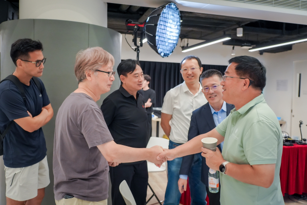 Professors and participants actively engage in the Q&A session, posing thought-provoking questions to Professor Deng